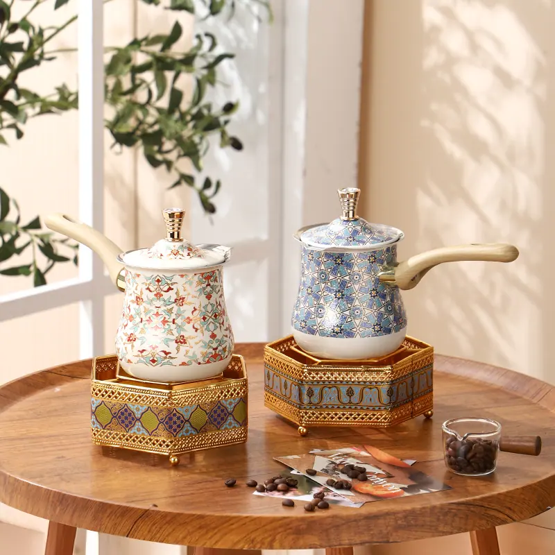Two Style 02 coffee pots with floral and blue geometric decal concepts